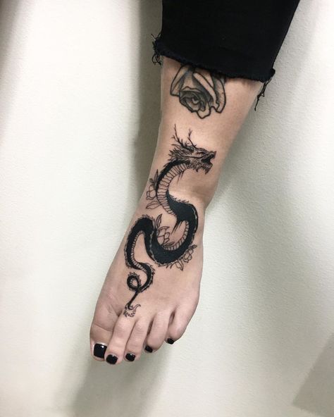 Kajka on Instagram: “👣🐍👣 #blacktattoo #onlyblackart #onlyblacktattoo #dragontattoo #dragon #snaketattoo #snake #linework #polandtattoo #polandtattoos…” Lily Tattoo Meaning, Dragon Tattoo Arm, Hidden Tattoos, Dragon Sleeve Tattoos, Dragon Tattoo For Women, Tatuaje A Color, Lily Tattoo, Dragon Tattoo Designs, Most Popular Tattoos