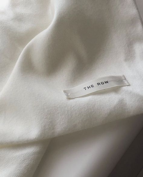 The Row Branding, The Row Packaging, Minimal Clothing Brand Logo, The Row Aesthetic, The Row Bindle, The Row Campaign Editorial, Editorial Logo Design, Brand Label Clothing Tag Design, Editorial Logo