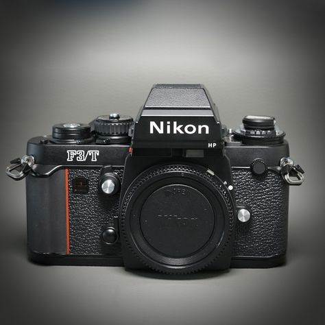 For offer this fabulous Nikon F3/T 35mm film SLR camera with HP viewfinder. Later ALL BLACK version made in 1985. In the 1980's this was the top of the line flagship camera from Nikon. All-metal construction, with titanium alloy top/bottom plates, and titanium film door.. Manual focus. This camera will last for decades to come. This camera has been recently professionally overhauled and is in excellent 100% working, film-tested condition. It is in PRISTINE cosmetic condition. No dings, dents, scratches, or paint loss. Meter, shutter, advance all working well.  Includes a fresh set of batteries installed. Works with a wide array of Nikon lenses, even modern AF-S lenses, but manual focus only. Nikon Lenses, Nikon F3, Folding Camera, Medium Format Camera, Old Cameras, Rangefinder Camera, 35mm Camera, Body Black, Shoot Film