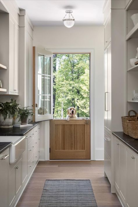 Beautiful separated pantry with swinging dutch doors for access to back patio. Photo: Jenn Verrier • • #customdesign #butlerspantry #dutchdoors #dog #design #whitewash #lightwood #whiteoakfloors #cabinetry #apronfrontsink #roomdecor #roomdesign #kitchendesign Scullery Pantry, Copper Metal Roof, Tudor Architecture, Interiors Kitchen, Built In Pantry, Tudor Style Homes, Revere Pewter, Herringbone Floor, Dutch Door