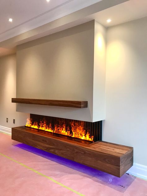 Modern fireplace. Linear fireplace. 3 sides fireplace.9’ custom water vapour fireplace. Hand made solid Walnut cabinet. Realistic Electric Fireplace, Fireplace Modern Design, Modern Electric Fireplace, Fireplace Feature Wall, Linear Fireplace, Water Vapor, Fireplace Tv Wall, Living Room Decor Fireplace, Custom Fireplace