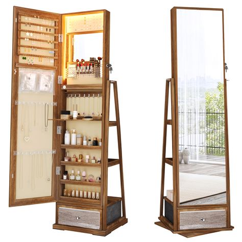 PRICES MAY VARY. Jewelry/Beauty Products Have Found Their Home: This jewelry cabinet is thoughtfully designed with earring slots, necklace hooks, and ring slots, providing the perfect haven for your precious items. Additionally, you can use the organizer's pockets, plastic trays, and storage shelves to give your cherished cosmetics the ideal sanctuary. Foldable Acrylic Panel and Built-In Makeup Mirror: Conveniently arrange your cosmetics and jewelry for makeup, jewelry trials, and skincare with Jewlrey Organization Mirror, Rotating Jewelry Organizer, Bathroom Mirror Organizer, Cute Storage Ideas For Small Rooms, Room Decor With Wooden Furniture, Bedroom Mirror With Storage, Bathroom Jewelry Storage, Large Makeup Organizer, Apartment Decor Storage