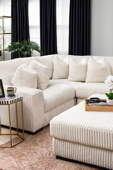 Plush and posh. Showcase your eye for on-trend texture with the statement-making cord upholstery of this sectional with chaise. Its stunningly soft fabric entices in an ivory hue, complementing contemporary color palettes. Sink into the cushions and plan to stay a while this cozy living room centerpiece highlights your high-end approach to comfort and style. Neutral Sectional With Chaise, Ashley Furniture Sectional The Classy Home, Ashley Furniture Sectional, Ashley Bladen Sectional, Carnaby 5-piece Sectional With Chaise, Oversized Sectional Sofa, Ashley Furniture Living Room, Ashley Home, Comfortable Sectional