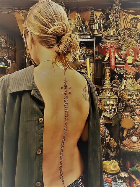 A traditional Sak yant tattoo. I asked the Adjarn to bless me with guidance, protection, and strength in my journey. The gold doesn’t stay on. It’s gold leaf that If I understood the translator correctly, seals the magic. Sak Yant Back Tattoo, Sak Yant Tattoo, Sak Yant, Spine Tattoos For Women, Spine Tattoos, Back Tattoo, Gold Leaf, Seals, Tattoos For Women