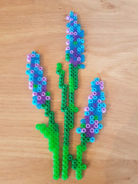 Hyacinth or Lavender flower bead perler hama pattern with stems and leaves Hama Bead Projects, Lavender Perler Beads, Pearler Bead Flower Patterns, Flower Perler Bead Pattern, Hama Beads Patterns Flower, Hama Beads Flower Pattern, Fusion Bead Ideas, Hama Bead Flowers, Perler Beads Flower Pattern