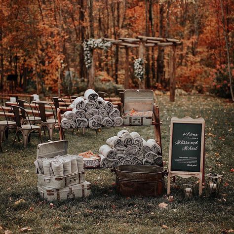 Keep your wedding guests warm at your outdoor fall or winter wedding ceremony by handing out cozy grey blankets. Complete this rustic blanket display with a wooden wedding welcome sign and a setup of matching cases! Here are other elegant ways to display blankets at your wedding. // Photo: Move Mountains Co. and Planner: Cristen & Co. Fall Wedding Outdoor Decorations, October Wedding Themes, Outdoor Wedding Ideas On A Budget, Cheap Fall Wedding Ideas, November Wedding Decorations, November Wedding Ideas, Fall Wedding Ideas October, Fall Wedding Theme Ideas, Display Blankets