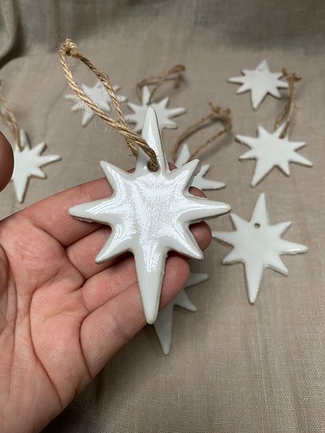 North Star 🌟 Christmas ornaments in stoneware clay. Comes tied with a natural string. size 10cm All items packed with care, padded with layers of bubble wrap and packaging cardboard so your item arrives safe. If any issues with delivery we are happy to replace your item free of charge. Sculpt Christmas Ornaments, Ceramic Garland Christmas, Nativity Clay Ornaments, Diy North Star Ornament, Salt Dough Stars, Paper Clay Ornaments, Christmas Airdry Clay Ornaments, Clay Diy Ornaments, Diy Ceramic Christmas Ornaments