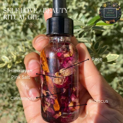 Embrace your inner radiance with our enchanting self-love and beauty ritual oil. Infused with potent hoodoo traditions and crafted with an exquisite blend of natural essences, this ritual oil is designed to empower and uplift your spirit.  Enriched with ingredients revered for their ability to promote self-love and enhance beauty, this oil is a vessel for harnessing your inner confidence and self-appreciation. Each drop is a moment of self-care, a ritual to manifest your inherent beauty and nurture self-love from within. Allow the aromatic embrace of this mystical oil to enhance your aura and magnify your self-love journey. How to Use: Dab a small amount of the ritual oil on your fingertips or palms. As you do so, visualize self-love and beauty emanating from within you.  Gently massage th Self Love Oil Recipe, Beauty Oil Witchcraft, Self Love Oil Recipe Witchcraft, Self Care Spells, Self Love Rituals, Self Love Oil, Manifestation Oil, Oil Witchcraft, Spell Oils