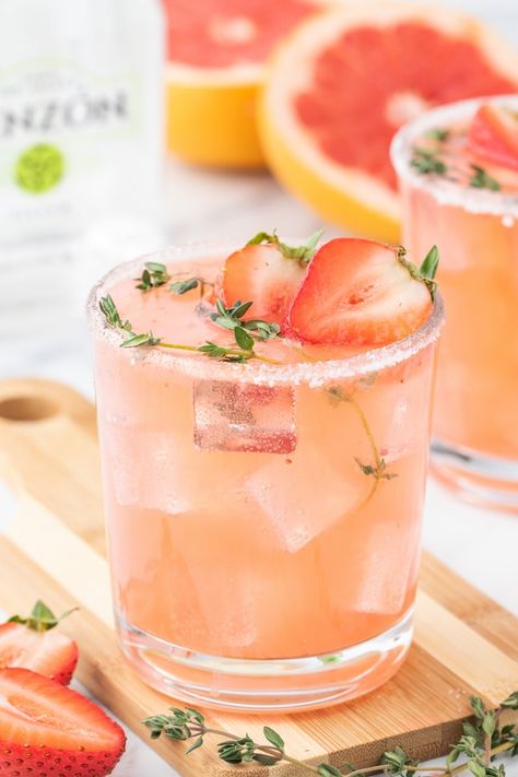 This fun and fizzy Strawberry Grapefruit Paloma is a refreshing and fruity twist on the classic Paloma cocktail we all know and love. With every sip, you'll appreciate and take notice of the perfect balance happening between the tart grapefruit and sweet strawberries. You're going to love this refreshing tequila based cocktail. Grapefruit Tequila Cocktail, Vodka Paloma Cocktail, Paloma Cocktail Tequila, Tequila Based Cocktails, Summer Entertaining Recipes, Rhubarb Bars, Grapefruit Recipes, Strawberry Cocktails, Grapefruit Cocktail