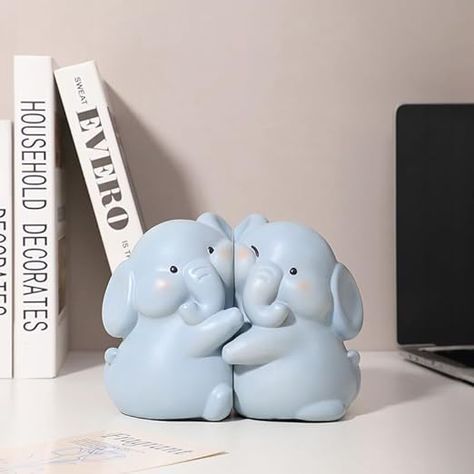 Cute Hug Elephants Decorative Bookends, Unique Book Ends to Hold Books Creative Resin Book Holder Stopper for Home Office Desk Bookshelf Decoration These decorative bookends will add a unique look to your desk or shelves while keeping book organized and in place so heavy books don't easily tip. Cute hug baby elephants book ends are both functional and decorative. Cute Bookends, Bookends Ideas, 2025 Wishlist, Resin Book, Bookshelf Decoration, Elephant Book, Cute Hug, Elephant Bookends, Desk Bookshelf