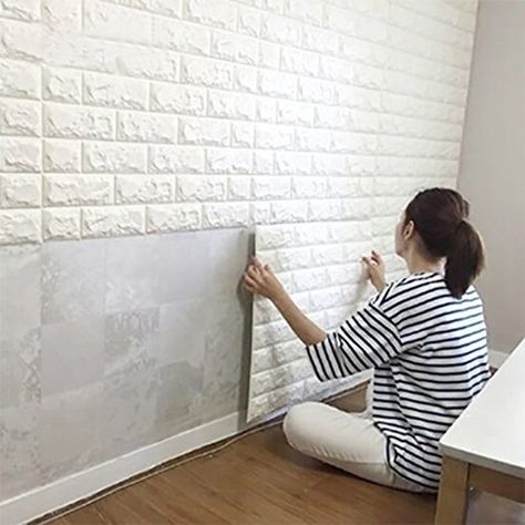 Give your home some character and add texture to your walls with peel-and-stick wall panels. 3d Brick Wall Panels, Brick Wall Panels, 3d Brick Wall, Tiles For Bedroom, White Brick Wallpaper, Tv Fal, Brick Wall Paneling, Living Room Background, Diy Wallpaper