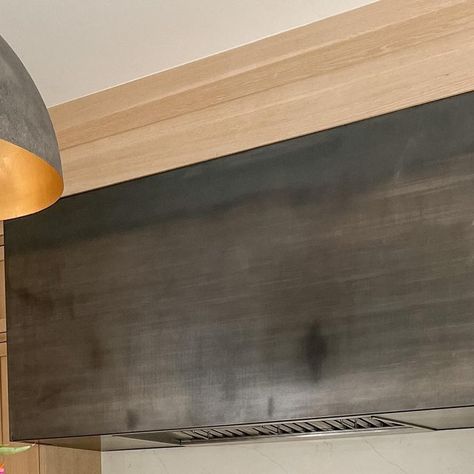 Melissa Liddiard | Intentional Design on Instagram: "One of the most asked questions of all time… What material is our hood? Steel sheet metal! . My husband found the coolest inspiration photo and we shared it with our builder. Then our builder worked hand-in-hand with a local steel company to create this beautiful finish. It definitely has a blue patina. . Make sure you check out stories today, I’m going to be sharing photos of what it looked like before. If you are hoping to replicate the lo Metal Range Hood Kitchen, Metal Kitchen Hood, Melissa Liddiard, Hood Vent Cover, Metal Range Hood, Kitchen Hood Design, Steel Company, Intentional Design, Steel Range Hood