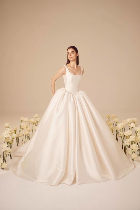 This luxurious modern basque waist mikado ballgown will have you feeling like royalty with a full luminous skirt. Wedding Dress With Big Skirt, Regal Wedding Dresses, Wedding Satin Ballgown, Silk Princess Wedding Dresses, Luxury Silk Wedding Ball Gown, Wedding Dress Basque Waist, Basque Waist Wedding Dress Satin, Long Sleeve Mikado Wedding Dress, Elegant Wedding Ball Gown With Voluminous Skirt