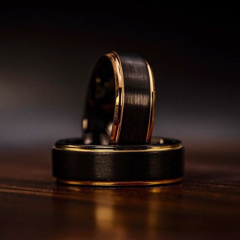 We are excited to present this bold black tungsten wedding band with 18k gold edges. Careful milling and craftsmanship are noticed throughout this wedding ring.HOW THE RINGS ARE MADE:-first this ring is milled from a perfectly square black tungsten block right down to a perfectly shaped ring-we then flip the ring vertically and carefully mill each side to a perfect 90 degree step edge and plate it with only the best 18k yellow gold-finally we sand, buff, and polish the ring so it has a brushed o Black Wedding Bands For Men, Black Gold Wedding Rings, Wedding Ring Yellow Gold, Mens Wedding Rings Black, Black Wedding Ring, Wedding Ring Black, Wedding Band Men, Black Tungsten Wedding Band, Mens Wedding Ring