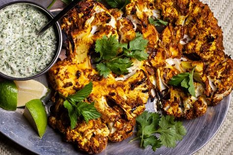 Marinating cauliflower in a yogurt-spiced paste adds an intense boost of flavor to this vegetarian main course. Easy Chile Relleno Recipe, Marinated Cauliflower, Grilled Cauliflower Steaks, Zucchini Frittata Recipe, Easy Breakfast Dishes, Bbq Veggies, Munchies Recipes, Ham Salad Recipes, Cauliflower Steak