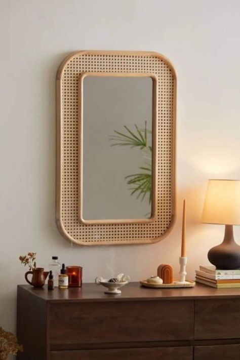 This extraordinary mirror, crafted entirely from real wood, brings captivating elegance to your decor with its durable natural wood frame. Reflecting the mastery of craftsmanship, this mirror stands out with the use of premium-grade materials that elevate its quality. The 4mm fade-resistant glass surface ensures a lasting brilliance, while the wooden frame emanates the warmth of nature, creating a unique character for your space. Mirrors Urban Outfitters, Cane Decor, Boho Apartment, Mirror Decor Ideas, Wardrobe Door Designs, Apartment Decoration, Rattan Mirror, Wooden Mirror, Décor Boho