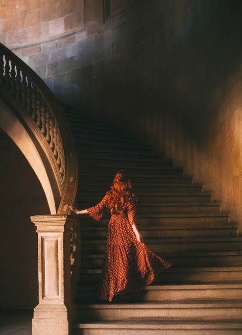 "Samantha walked up the stairs. The building was old. Too old. But it still kept it's regal appearance. She looked for the woman on the black dress. Was she hiding here?" Red Hair Royal Aesthetic, Person On Stairs Reference, Book Inspiration Pictures, Medieval Photography, Mystic Photography, Mystical Photography, Medieval Wallpaper, Mystical Aesthetic, Kind Aesthetic