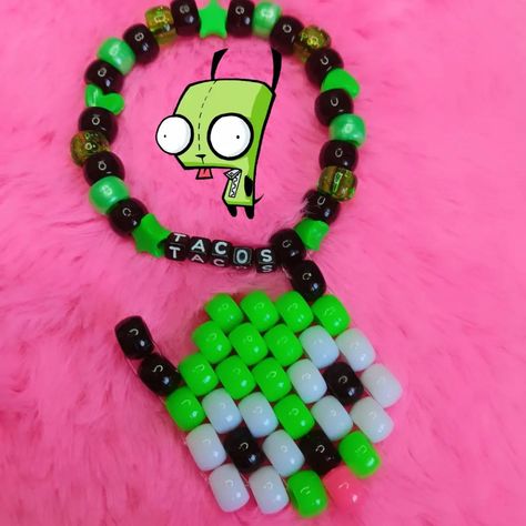 gir tacos invader zim kandi bracelet !!! 🩷🌸❤️🌸🧡🌸💛🌸💚🌸💙🌸💜 🎀 SOLD! ♡ check out my page for tons of other kandi + jewelry pics >:3 ♡ handmade with love by me! ♡ freebies with every order! thank you for your support <33 🩷🌸❤️🌸🧡🌸💛🌸💚🌸💙🌸💜 shares are greatly appreciated! you are helping me grow my small business <3 PLUR!! 🫶🌈 #kandi #kandikid #kandicuff #kandibracelet #kidcore #scenecore #dreamcore #pinkcore #kawaii #decora #fairykei #scene #emo #scenekid #indie #invaderzim #girinvaderzim Invader Zim Kandi Bracelet, Invader Zim Bracelet, Scene Kandi Bracelets, Gir Kandi, Invaders Zim, Scene Bracelets, Kandi Jewelry, Scene Kandi, Scene Diy