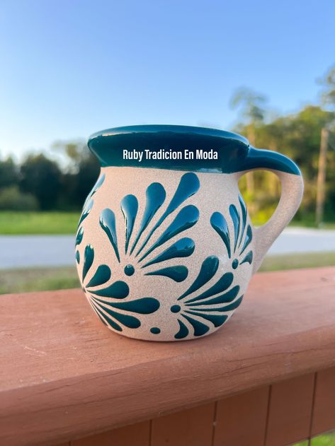 This Mexican Clay Mug/ Clay Cups/ Jarritos Mexicanos/ Tazas Artesanales/ Artesanias Mexicanas is a beautiful addition to your kitchenware collection. Handcrafted with traditional style, these mugs feature a lovely floral pattern that is sure to catch the eye. Made from high-quality ceramic material, these mugs are durable and heat resistant. You can enjoy your hot beverages without worrying about any damage to the mug. Not only are these mugs functional, but they are also non-customised and perf