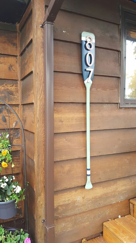 My house number project. I used an old paddle and ordered the copper numbers to match our railing caps. Dock Decor Ideas Lakeside, Lake House Theme, River Signs, Paddle Decor, Oar Decor, Lake Cabin Decor, Lakehouse Ideas, Boat Interiors, Lake House Interior