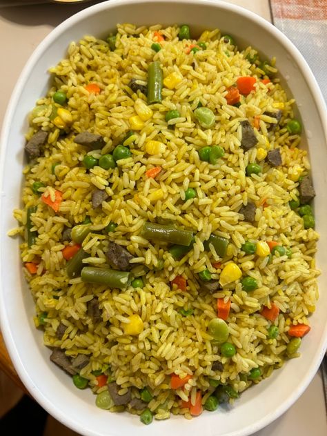 With all the veggies 🌽 string beans 🥕 🫑 peas Nigeria Dishes, Nigeria Fried Rice, Ofada Rice Nigerian Food, Ugandan Rice And Beans, Nigeria Food Pictures, Pictures Of Nigerian Food, Cooking With Turmeric, Nigeria Food, Rice Side Dish Recipes