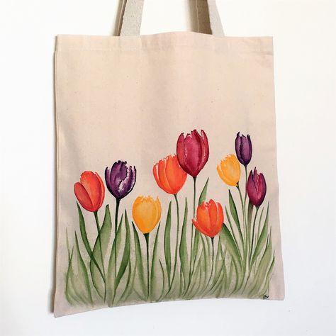 Thick beige bag (270gr/m2),  100% cotton.  Very good quality.  35 x40 cm  Handles: 62 cm.  Hand painted illustration.  On the theme of spring and more particularly tulips.  Machine washable at 30 degrees.  (40 max).  Very colorful and bright bag. Painting Canvas Tote Bags, Painting On Canvas Tote Bags, Painted Bag Ideas, Paintings On Bags, Painting On Bags Ideas, Painting Bags Ideas, Painted Bags Ideas, Bag Painting Ideas Diy, Tote Bags Painting Ideas