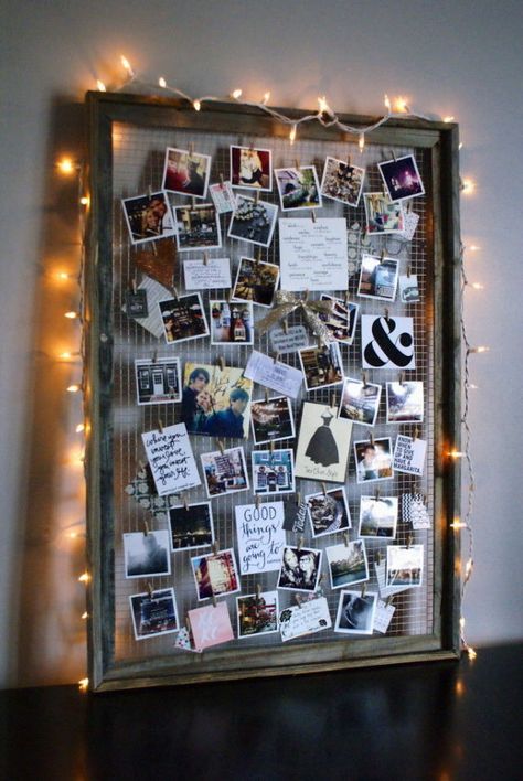 By removing the glass interior and adding wire, you can elevate an old frame into a beautifully crafted photo collage-esque display. Bonus: Add string lights around the frame to create a soft glow. Get the tutorial at Anastasia Co.   - CountryLiving.com Projek Kayu, Photo Collage Diy, Diy Dorm Decor, Polaroid Wall, Dorm Diy, Old Picture Frames, Hemma Diy, Photo Board, Decoration Photo