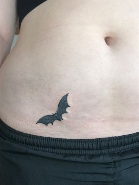 Hand Poked Tattoo Unique, Bat Waist Tattoo, Tattoos Hip, Flying Bats Tattoo, Cute Small Goth Tattoos, Stick And Poke Bat Tattoo, Mini Bat Tattoo, Thigh And Hip Tattoo, Bat Hip Tattoo