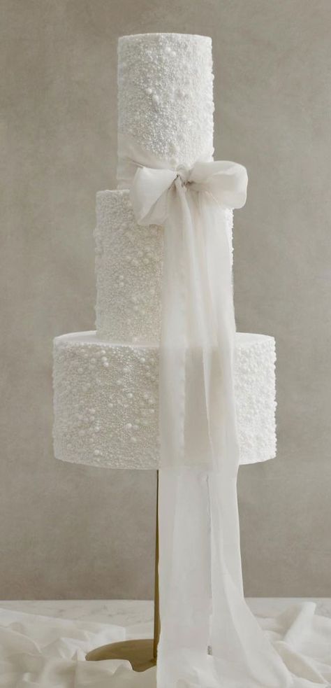 50 Artistic Masterpiece Wedding Cakes : Pearl & Bow Cake Pearls Wedding Cake, Wedding Cakes With Bows, Wedding Cakes 2024 Trends, White Wedding Cakes Elegant, Pearl Cake Wedding, Wedding Cake 2024 Trends, Wedding Cake Trends For 2024, Pearl Theme Wedding, Wedding Cakes 2024