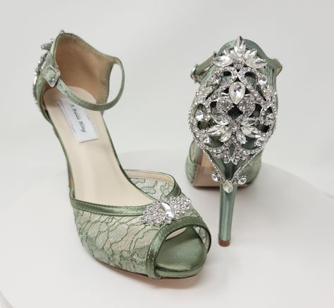 "Sage Green Lace Wedding Shoes with sparkling crystals on the front and the back of the shoe. Lace Bridal shoes available in over 100 additional colors, including white and ivory.  We can also color match a sample you send us.  The shoes in the listing have been dyed Fino Celeron (commonly known as Sage).  If you would like another color from my chart, a designer color or sending me a swatch, please pick from the dye color drop down menu and then let me know the color you would like in the perso Sage Green Quinceanera Heels, Green Quinceanera Shoes, White And Green Wedding Dress, Sage Green Quinceanera Theme, Sage Green Heels, Sage Green Quinceanera Dresses, Shoes Sage Green, Sage Green Quinceanera, Green Bridal Shoes