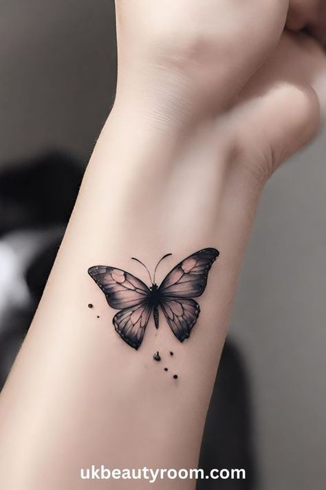 7dd1a7375ef32fe6cb93e41484bd2fae Butterfly tattoo on a wrist with delicate black and pink wings, showcasing intricate details and small dotted accents. | Sky Rye Design Butterfly Tattoo Wrist, Butterfly Tattoo On Wrist, Pink Black Butterfly, Watercolor Butterfly Tattoo, Black Butterfly Tattoo, Butterfly Tattoo Ideas, Butterfly Wrist Tattoo, Pink Wings, Butterfly Outline