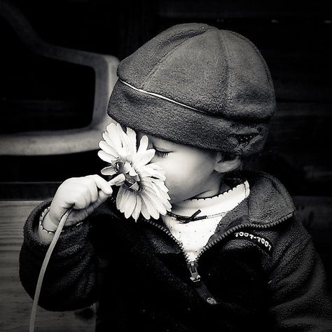 Smell the flowers! The sense of smell affects your body's emotions in both physical and mental health. Smelling Flowers, Jolie Photo, Black N White, Pics Art, 로고 디자인, Little People, Black And White Photography, A Flower, Make Me Smile