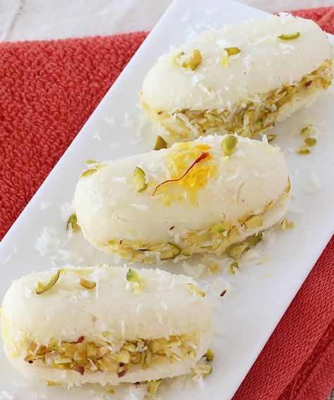 Bengali Cham Cham  with Stuffed with Mawa (Khoya) and Dryfruits - Delicious Indian Dessert -  Step by Step Recipe Cham Cham Sweet, Indian Deserts, Indian Mithai, Durga Pooja, Green Cardamom, Lemon Bar, Desiccated Coconut, Tandoori Masala, Indian Dessert