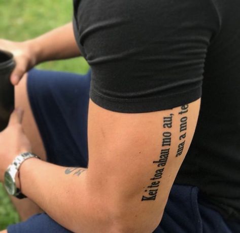 Bicep Script Tattoo Men, Men Tricep Tattoo Ideas, Tattoo On Biceps Men, Outside Bicep Tattoo, Bicep Script Tattoo, Back Of Tricep Tattoo, Men Tricep Tattoo, Bible Verse Tattoo Men, Bicep Word Tattoo