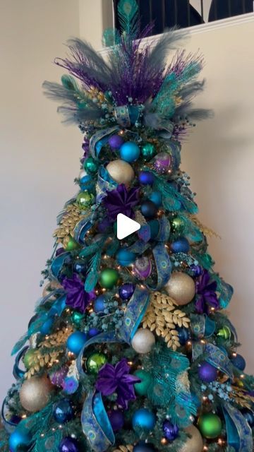 Antoinette Boston on Instagram: "Never forget my first peacock tree! 😍 It was also the first of 95 trees I decorated in 2022 and set the tone for the rest of the season! 
.
.
.
.
#christmasdecor #christmastree #noel #xmas #xmastree #navidad #christmas #christmasiscoming #natal #holidaydecor #christmasinspo #peacocktree #peacock" Peacock Christmas Decorations, Peacock Christmas Tree, Peacock Christmas, Creative Christmas Trees, Diy Dollar Tree Decor, Christmas Inspo, Dollar Tree Decor, Christmas Is Coming, Holiday Tree