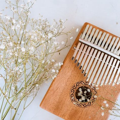 #Kalimba #aesthetic #flowers#music Kalimba Pictures, Marimba Aesthetic, Kalimba Aesthetic, Musical Instruments Aesthetic, Aesthetic Instruments, Thumb Piano, Finger Protector, Aesthetic Flowers, 8th Sign