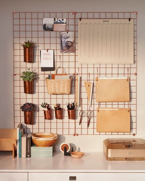 To keep your desktop uncluttered, hang supplies and folders from hooks and clips on an easy access grid. Urban Outfitters wire wall grids, in Copper (4 shown), $59 each, urbanoutfitters.com. Lostine copper cups, $30 for small and $45 for large, lostine.com. Basketville Upscale Mail basket, $17, basketville.com. hang copper containers on kitchen wall for peppers Reka Bentuk Bilik Tidur, Decoration Candles, Bureau Decor, Hiasan Bilik Tidur, Bilik Idaman, Diy Casa, Hiasan Bilik, Bilik Tidur, Wall Desk