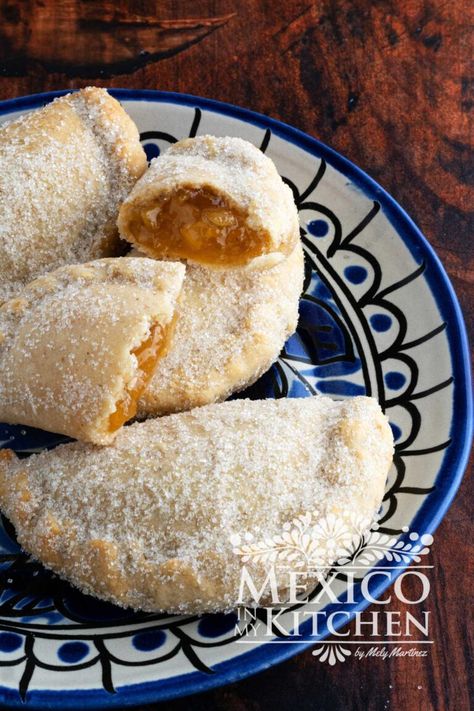 Dessert empanadas, also known as sweet empanadas, are a delectable variation of the traditional savory empanadas. They are easy to make and will satisfy even the most discerning sweet tooth. Pina Empanadas Recipe, Mexican Sweet Empanadas Recipe, Strawberry Empanadas Recipe, Empanadas Dough Sweet, Authentic Mexican Empanadas Recipe, Peach Empanadas Recipes, Desert Empanadas, Mexican Dessert Empanadas, Mexican Holiday Desserts