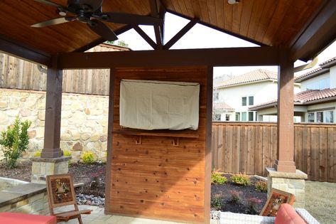 The interior of this custom cabana includes a custom cedar TV wall and cedar mantel. Patio Tv, Irving Texas, Tv Ideas, Patio Deck Designs, Patio Fireplace, Backyard Gazebo, Deck Designs Backyard, Backyard Pavilion, Backyard Kitchen