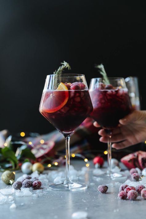 This Christmas Sangria is the most festive red sangria recipe for all of your holiday celebrations! It's the best red sangria ever, and SO easy to make. It's made with your favorite red wine, a touch of cinnamon simple syrup, pomegranate juice, cranberry juice, a little orange liqueur, pomegranate arils, sliced oranges, honeycrisp apples, and fresh cranberries! #sangria #cocktail #christmas #holidayrecipe Holiday Sangria Recipes, Thanksgiving Sangria, Best Sangria Recipe, Cranberry Sangria, Red Sangria Recipes, Winter Sangria, Holiday Sangria, Cinnamon Simple Syrup, Christmas Sangria