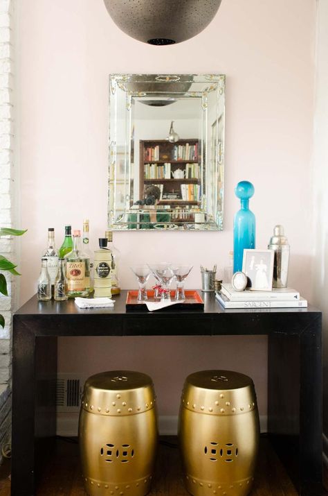 Behr Stolen Kiss, a soft and light blush pink paint color in a living room by Kevin O'Gara #blushpink #pinkwalls #pinkpaint #blushpaint #behrpaint #stolenkiss #behrstolenkiss #paintingideas #pinkpaintcolors #interiordesign Behr Stolen Kiss, Blush Pink Paint Color, Pink Paint Color, Blush Pink Paint, Stolen Kiss, Pink Accent Walls, Pink Rooms, Pink Paint Colors, Parsons Table