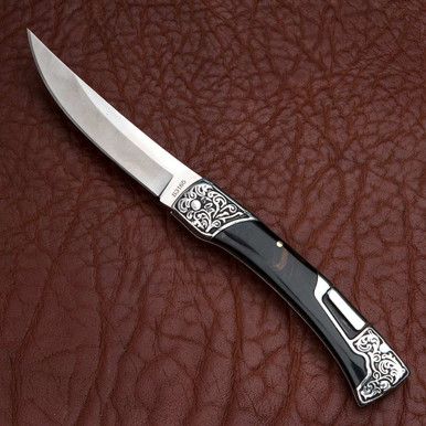 This tough and handsome folding knife, with its 3-3/4 blade (Overall open length 8-3/8), features an unusual saddle-style locking mechanism that straddles the knife back. Beautifully designed, with dark, resin-impregnated wood scales and delicate curlicue scrollwork on the stainless steel bolsters. Visually, it has a graceful curve whether closed or opened, and a very pleasant weight in the hand. It not only an excellent tool, but beautiful to look at and to hold as well. And it has a stainless Knife Aesthetic, Mode Steampunk, Pretty Knives, Dagger Knife, Knife Collection, Cool Swords, Cool Knives, Making Tools, Folding Knife