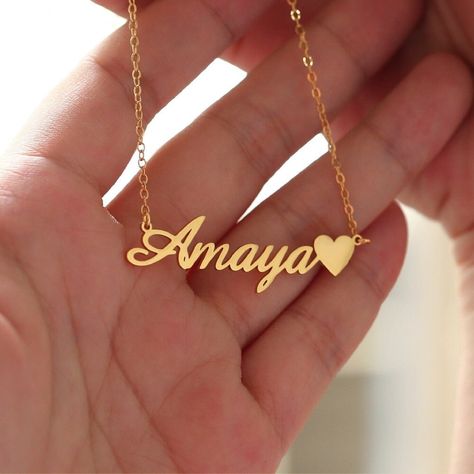 "Custom Name Necklace with Heart,Rose Gold Name Necklace,Dainty Name Necklace,Unique Name Necklace,Minimalist Necklace,Birthday Day Gift ✨Description 1、Color: gold plated, rose gold plated, silver 2、Chain length: 14 \", 16\", 18 \", 20\", 22 \" 3、Gift box: All our necklaces are preparing gifts in elegant jewels, ready to use as gifts. ✨How to order? 1、Select necklace color and material 2、Select necklace length 3、Leave the content you want to customize in the custom box 🎁Transportation time 1、Our manual time is 3-5 working days 2、The transportation time is 8-10 working days, and the working day outside Australia is 8-12 working days. 🌈About jewelry 1、 Don't leave a wet environment for a long time 2、 Avoid contact with perfume, body oil and other chemicals 3、 Do not use chemical cleaner 🙌 Customize Name Necklace, Name Necklace With Heart, Name Chain Gold, Gold Necklace With Name, Necklaces With Names, Jewelry Names, Kalung Choker, Name Chain, Name Necklace Gold