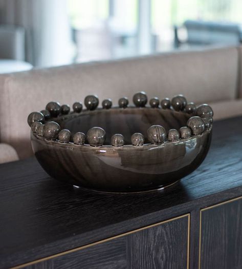 This Black Bobble Edged Bowl adds a sophisticated touch to any space. It is ideal for displaying items or fruit and offers an attractive ceramic finish. Enhancing living and dining rooms, this bowl is sure to leave an elegant impression. It is handmade with a unique design, featuring black glaze, and a bobbled edge for a contemporary feel. Whether you're entertaining or just adding a touch of style, it's a beautiful addition to any home. Dimensions: H:140 Dia:370 mm. Specifications: Materials: C Decor 2024, Black Glaze, Computer Room, Living Room End Tables, Decorative Bowl, Living And Dining Room, Pottery Ideas, Black Ceramic, Fruit Bowl