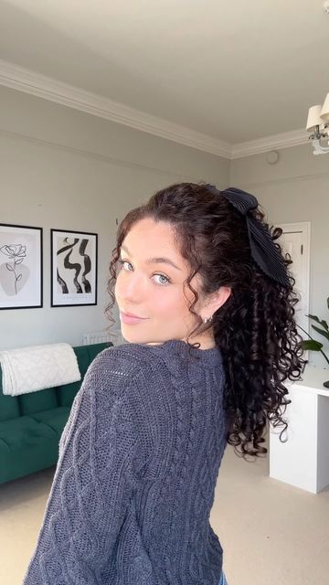 Sophie Marie on Instagram: "The cutest ponytail doesn’t exi… @sophiemariecurly 🖤🎬 Sharing one of my fave go-to easy hairstyles! A great hack if you want to make your hair look longer 😍🎀 Both the bow and clip are from @clairesstores 🏷️tag your curlfriends xoxo #curlyhairstyle #curlyhair #ponytail #hairtrends" Short Curly Hairstyles Ponytail, Long Curly Hair Low Ponytail, Naturally Curly Ponytail, Low Pigtails Curly Hair, Mid Curly Ponytail, Curly Low Pigtails, Curly Low Ponytail, Curly Hairstyles Ponytail, Curly Ponytail With Bow