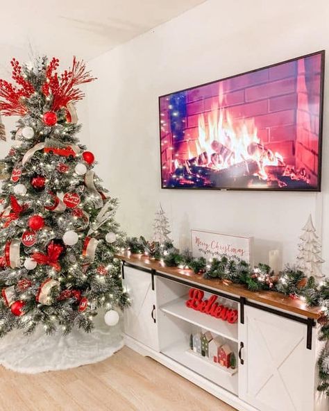 20 Christmas TV Stand Styling Ideas » Lady Decluttered Christmas Garland For Tv Stand, Cute Christmas House Decor, Christmas Decor Under Tv Stand, Christmas House Interior Living Rooms, Christmas Tree Next To Tv Stand, Christmas Decorations Entertainment Center, Tv Decoration Christmas, Christmas Decor Ideas For Entertainment Center, Cute Christmas Decor For Apartments