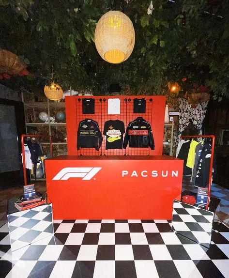 F1 PacSun Collab Pop-Up Store Install in West Hollywood Pacsun Logo, Checkered Flooring, Grid Panel, Dj Booth, Event Production, Custom Signage, Hanger Rack, Branding Services, Red Walls