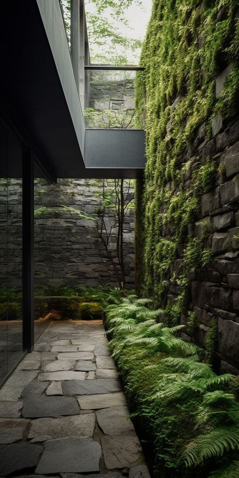 A serene and lush moss garden with modern design and stone wall feature, infusing the outdoor space with natural texture and calming greenery, creating a serene and inviting ambiance. Stone Wall Feature, Garden Modern Design, Hillside Garden, Bali House, Wall Feature, Vertical Garden Wall, Garden Modern, Zen Design, Smart Home Design