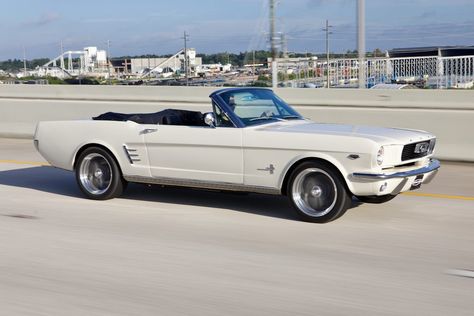 Revology 1966 Mustang Convertible in Wimbledon White with Oxford White top and Porsche Black Nappa leather interior. This car features LED headlamps, no fog lamps, Mustang fuel cap, rear valance with bumperettes, quarter trim ornaments, and stainless rocker moldings. The Premium package joins the GT package in our 1965-66 Mustang lineup. Like the GT, it is equipped with the 460hp Ford 5.0 Gen 3 Ti-VCT V8 engine, so it delivers the same performance, with a slightly different look. Mustang 1966 Convertible, 1965 Shelby Mustang, 1967 Ford Mustang Convertible, White Convertible Mustang, White Vintage Convertible, Ford Mustang Convertible 1967, Vintage White Mustang, Vintage Mustang Convertible, White Mustang Aesthetic