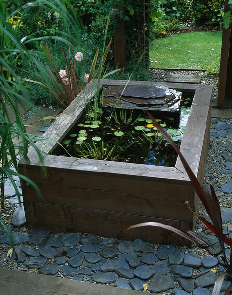 Raised Water Features In The Garden, Wooden Water Features, Raised Water Feature, Small Raised Pond Ideas, Raised Garden Pond Ideas, Corner Pond Ideas, Raised Pond With Waterfall, Small Raised Pond, Raised Pond Ideas